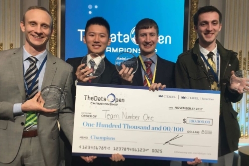 The Data Open Championship 2017 winners holding the $100,000 grand prize check at the NYSE.